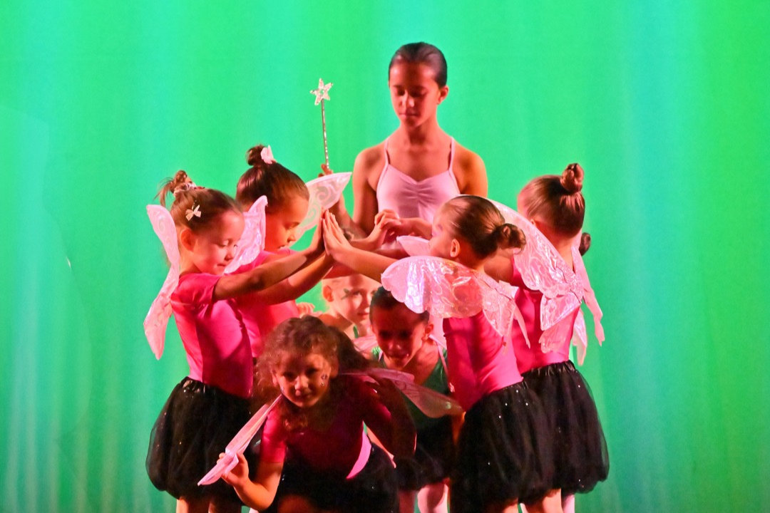 person in white ballet shoes